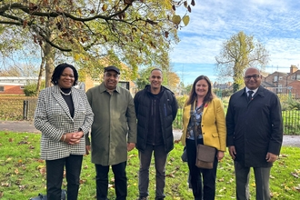 Councillor Cecile Wright, Councillor Gulfraz Nawaz, Community Organiser, Adam Dosunmu Slater, Eilish McGuinness, Chief Executive, The National Lottery Heritage Fund, Councillor Baggy Shanker stood together in a park