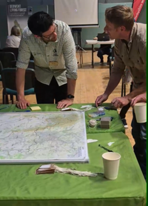 Two people talking at the Wooded Habitat Creation Workshop at Darley Dale 